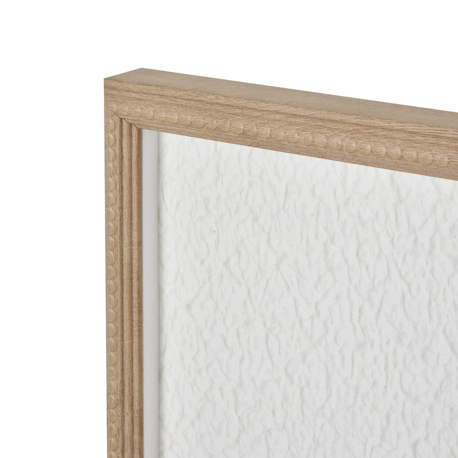 White feather artwork in beaded frame, minimalist modern home decor with natural texture and neutral tones by Sostter at brixbailey.com