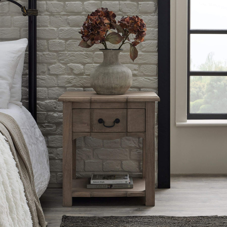 Handcrafted French provincial side table with hardwood construction, bleached wood finish, and black iron handles. by Sostter at brixbailey.com