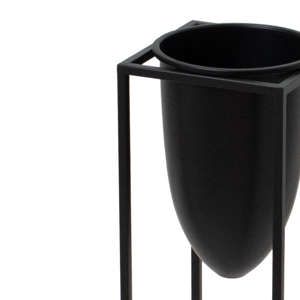 Matte black industrial modern metal planter with sleek bullet design, 62cm tall, for minimalist interiors by Sostter at brixbailey.com