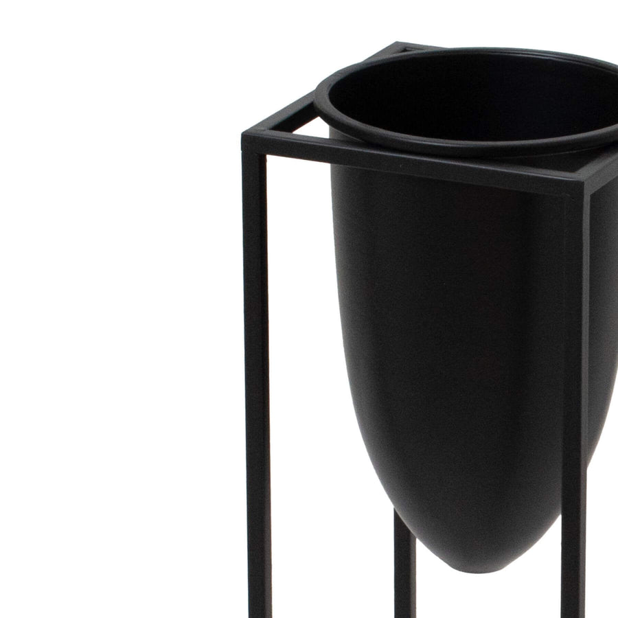 Matte black industrial modern metal planter with sleek bullet design, 62cm tall, for minimalist interiors by Sostter at brixbailey.com