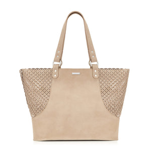 soft nubuck leather dog carrier bag in a comforting nude tone, shown in warm morning light