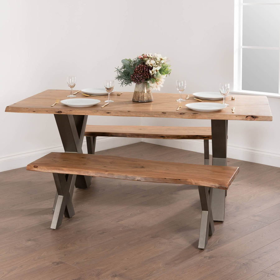 Handcrafted live edge acacia wood bench with grey metal frame, showcasing natural grain and organic contours. by Sostter at brixbailey.com