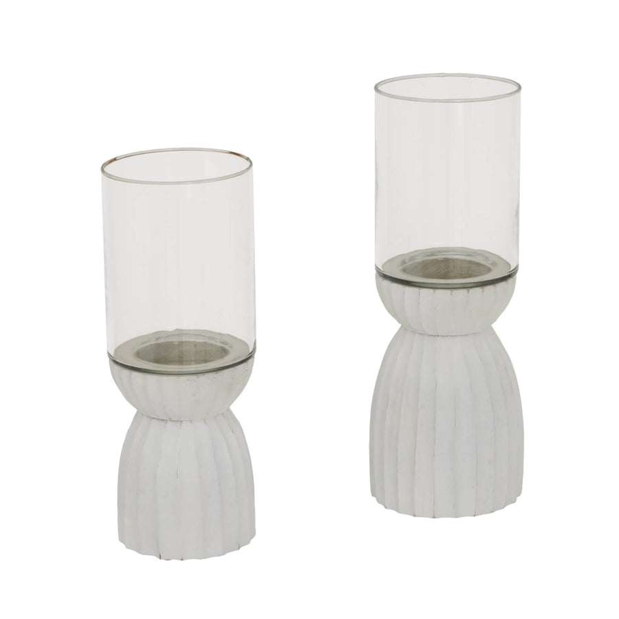 White carved hurricane lantern with intricate geometric patterns, durable glass, warm atmospheric glow by Sostter at brixbailey.com
