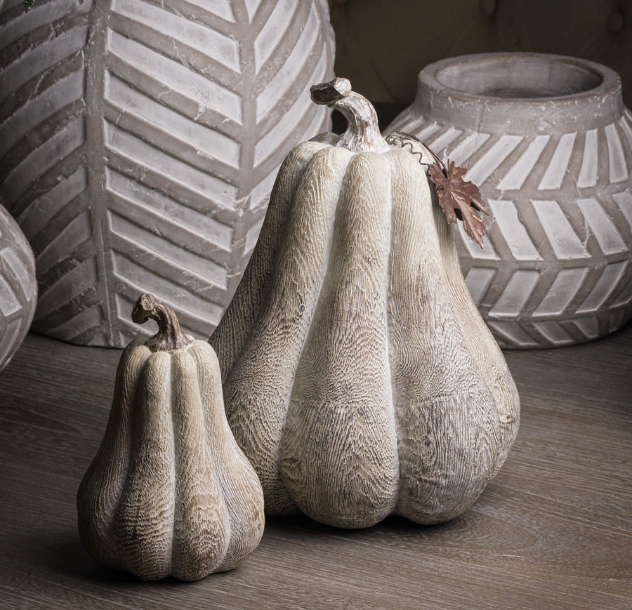 Handcrafted wood-effect resin pumpkin with whitewashed finish, bronze leaf accents, and wooden stalk for autumn decor by Sostter at brixbailey.com