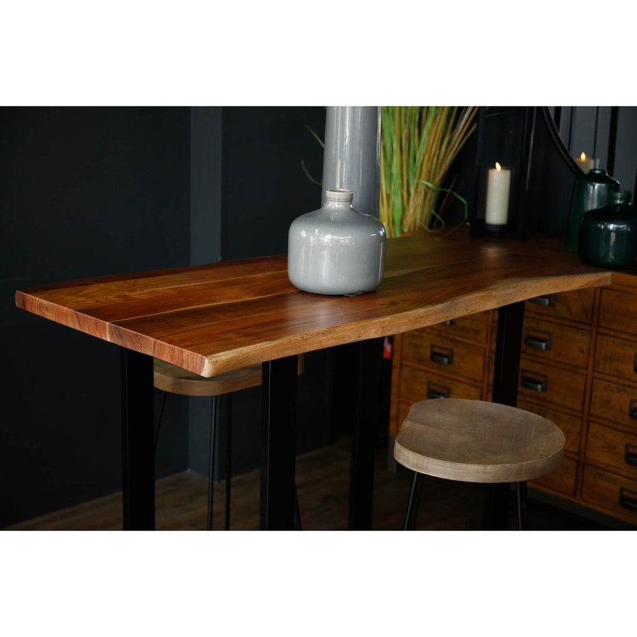 Live edge acacia wood bar table with black metal base, showcasing natural grain and rustic-industrial style. by Sostter at brixbailey.com