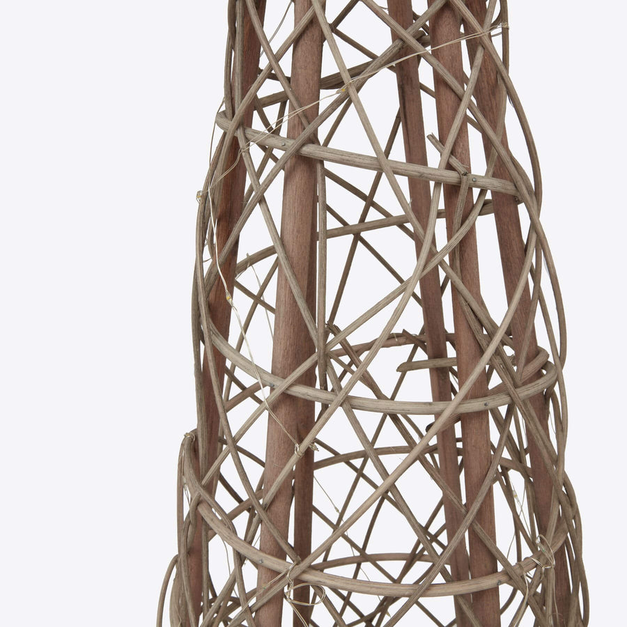 Handwoven LED wicker tree with warm white lights, rustic brown natural fibers, and star-topped holiday decor. by Sostter at brixbailey.com