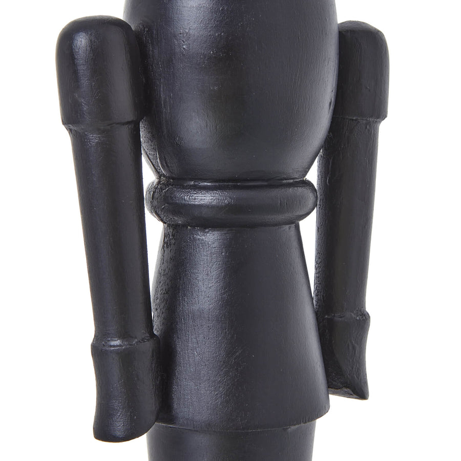 Black wooden Nordic nutcracker with minimalist design, 50cm tall, for modern Christmas decor by Sostter at brixbailey.com
