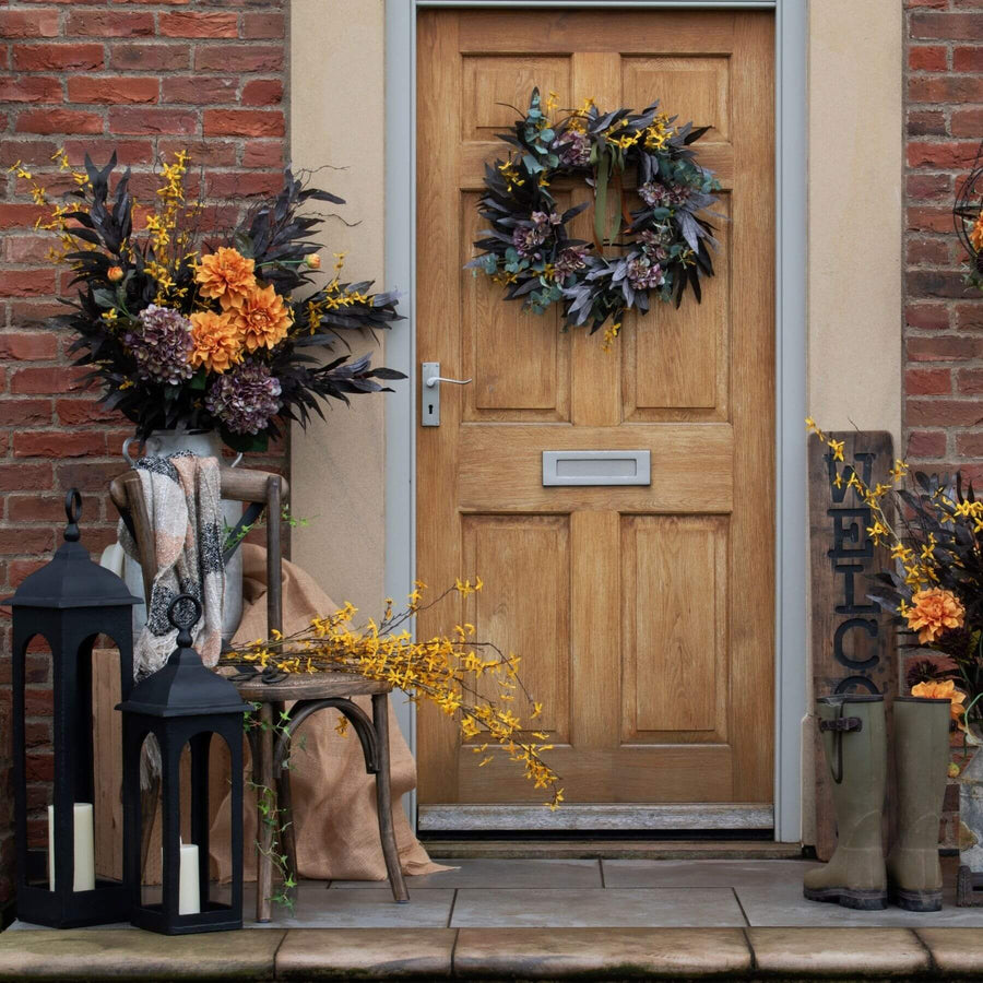 Handcrafted orange faux dahlia spray with realistic layered petals for autumn home decor by Sostter at brixbailey.com