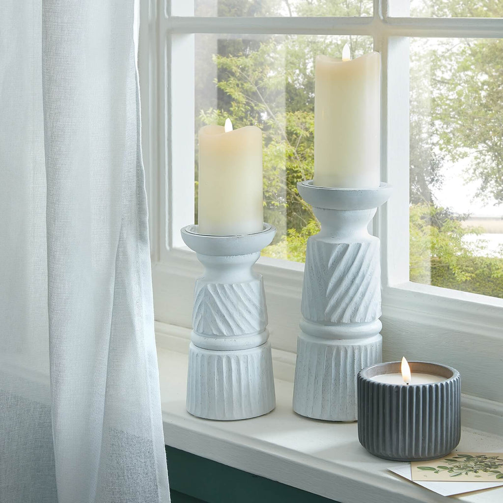 Hand-carved white wooden candle holder with intricate patterns, 30cm tall, for modern or traditional decor. by RoomLondon at brixbailey.com