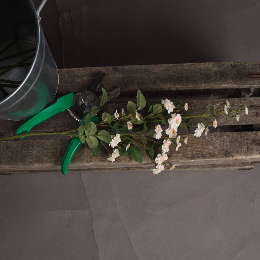Lifelike cream artificial rose spray with realistic petals, perfect for floral arrangements or minimalist decor by Sostter at brixbailey.com
