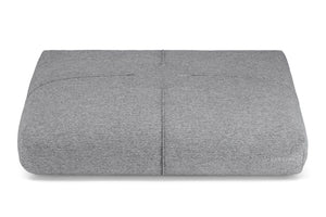 a serene anthracite grey dog cushion with soft decorative stitching in warm, inviting light
