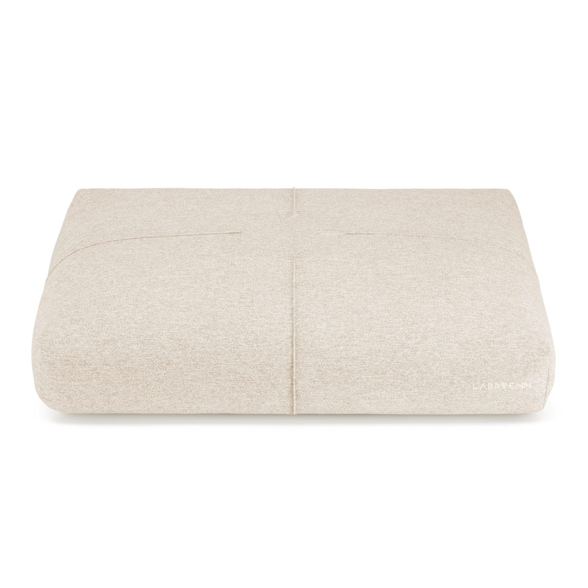 bold beige finno dog cushion with elegant stitching on a dark background