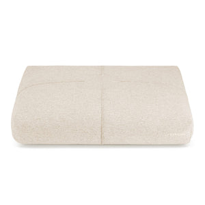 bold beige finno dog cushion with elegant stitching on a dark background