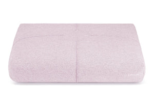 soft pink finno dog cushion with elegant stitching on a cozy bed