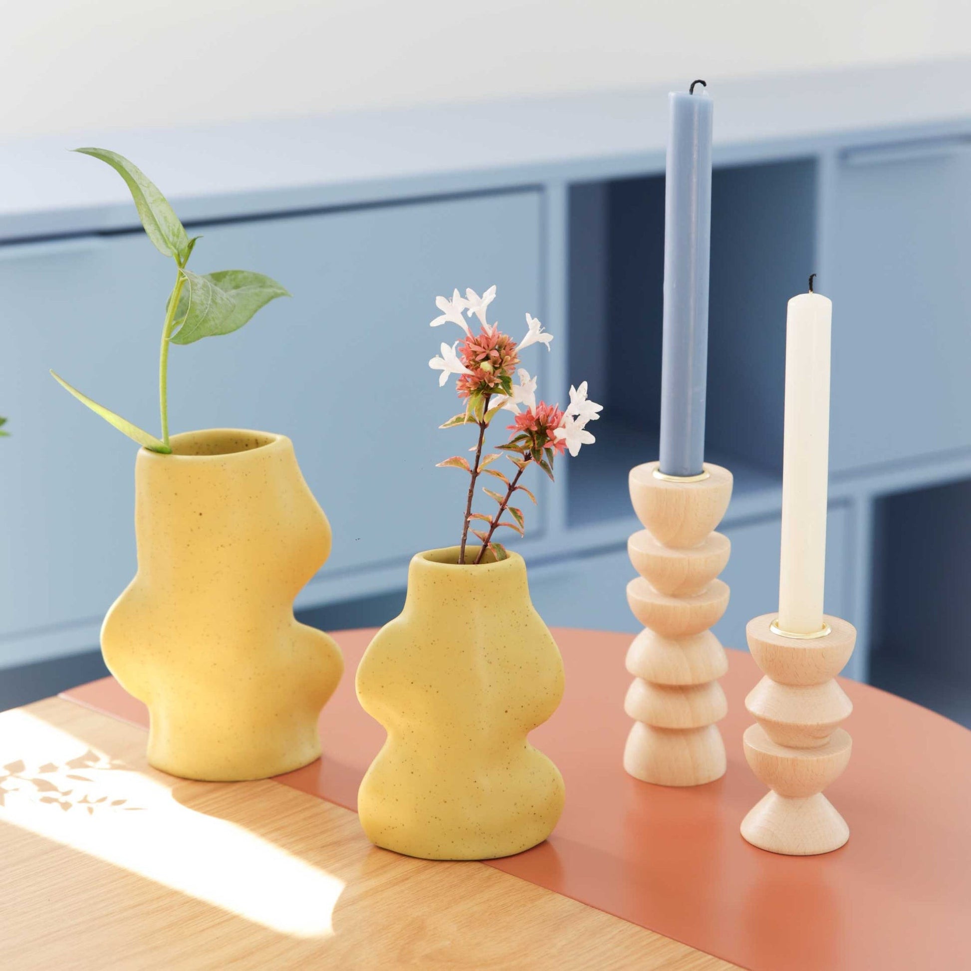 elegant pistachio ceramic vase on a marble table, its graceful curves catching soft morning light