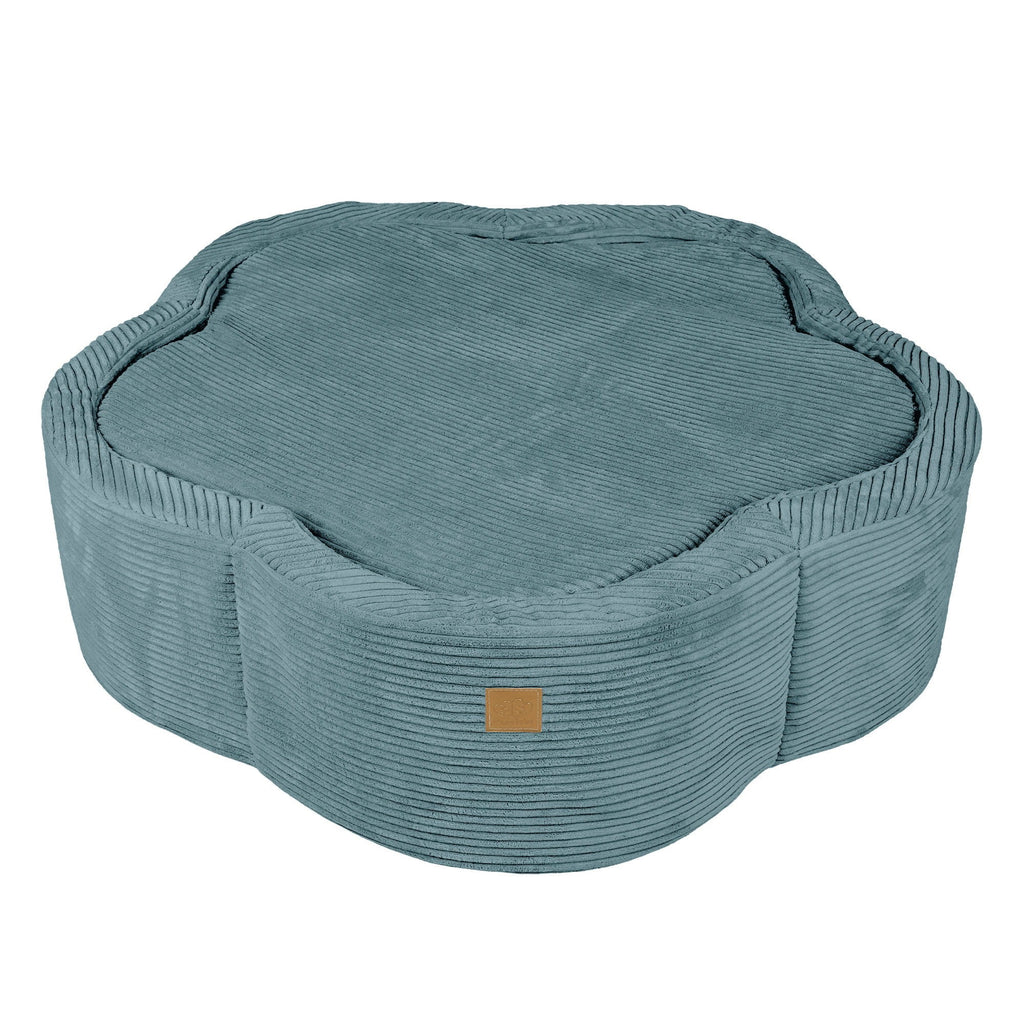 a soft turquoise flower-shaped baby ball pit nestled in a cozy nursery corner