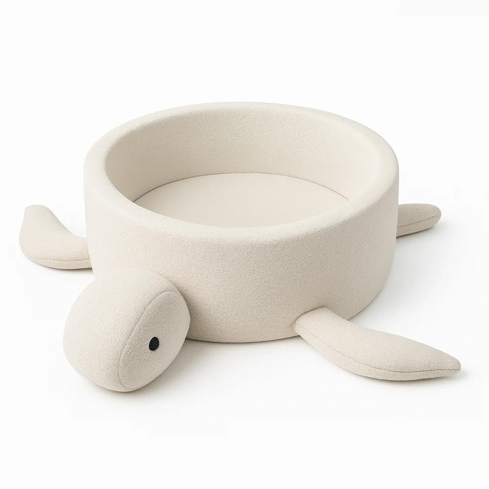 a baby playing in a cozy beige boucle turtle ball pit, soft foam walls and warm morning light