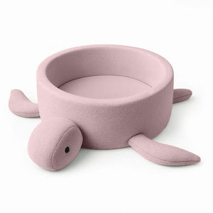 soft pink boucle turtle ball pit for baby, a cozy sensory play haven in warm morning light