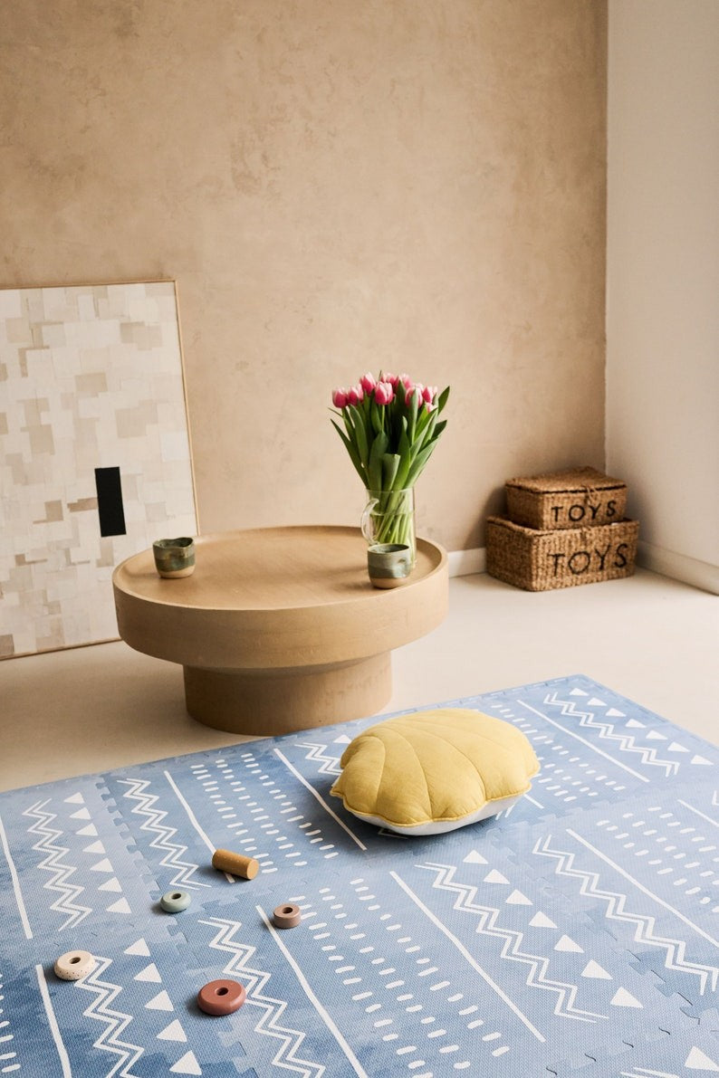 a soft boho azure foam playmat in gentle morning light, perfect for a baby's peaceful playtime