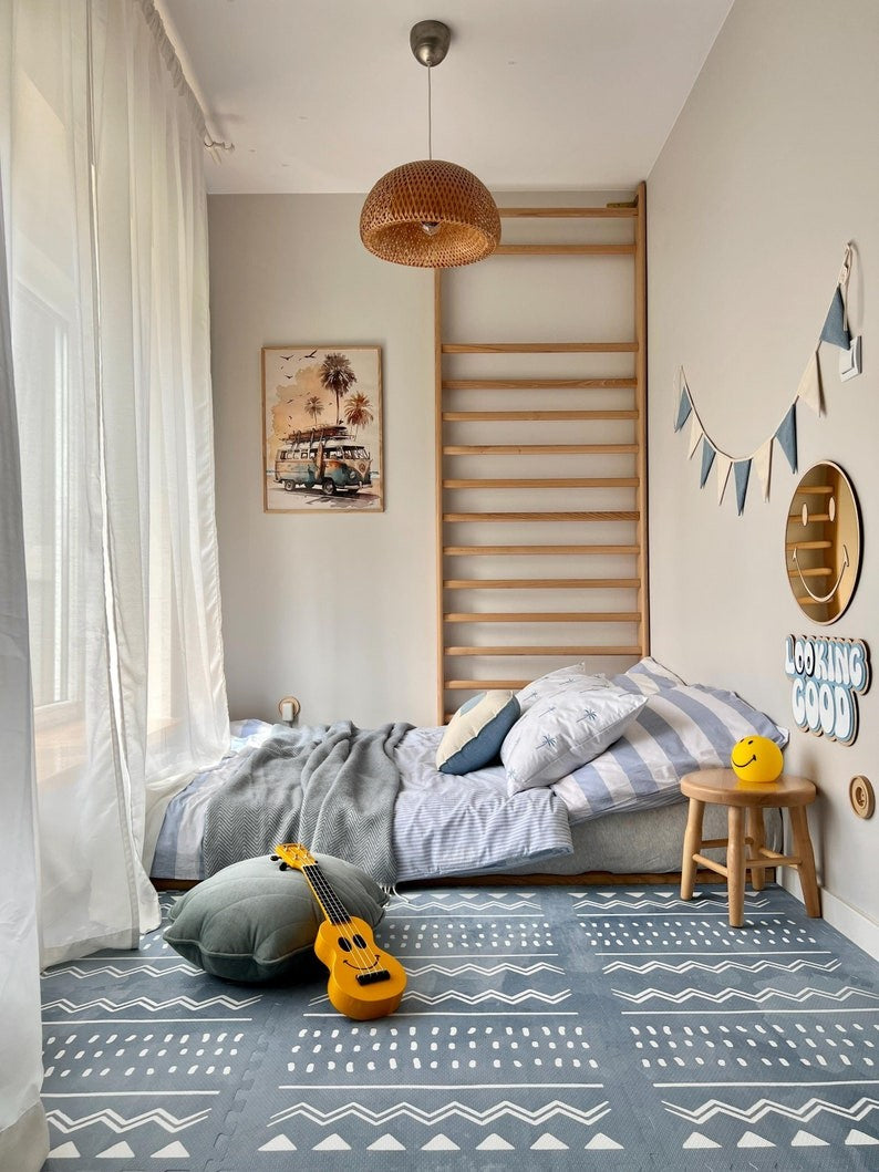 a sophisticated azure boho foam playmat arranged elegantly in a sunlit nursery