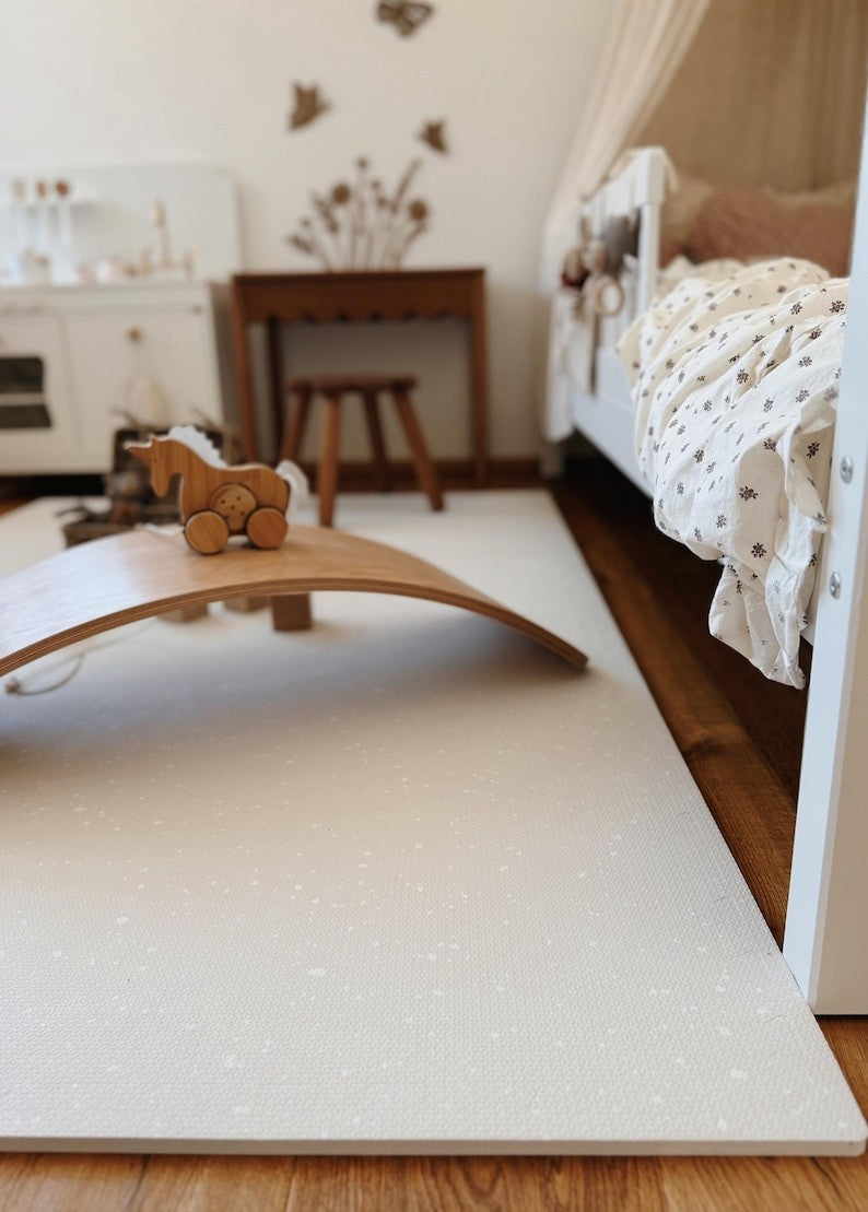 bold cashmere foam playmat with soft spots for safe baby play