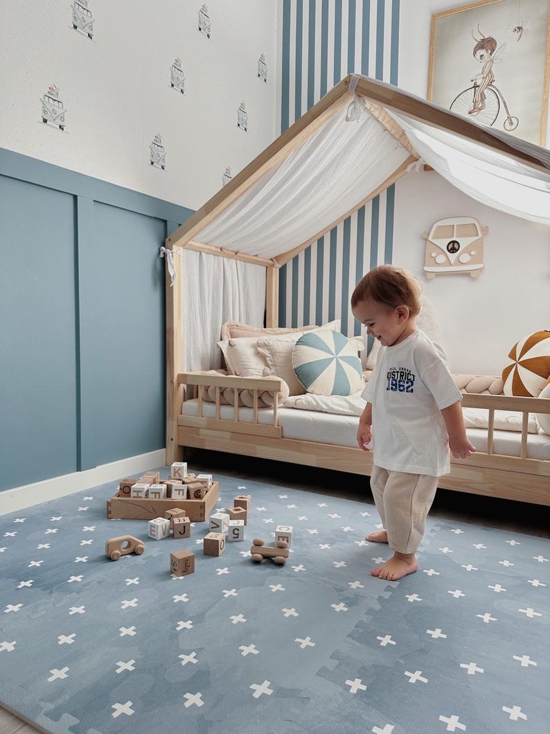 close-up of a stylish azure cross-patterned foam playmat in soft morning light