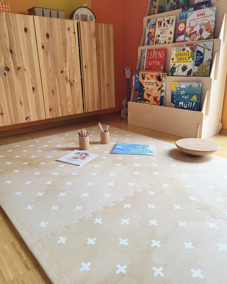 bold close-up of cross sand foam mat in dramatic morning light