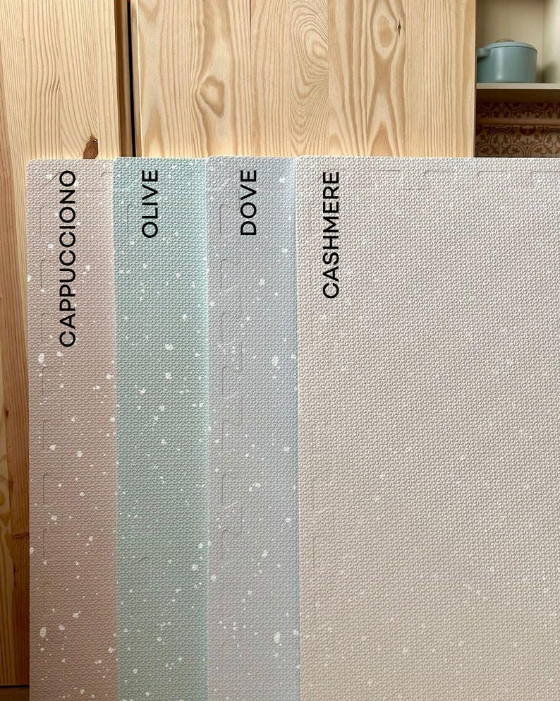 soft dove grey foam playmat in a bright, minimalist nursery setting