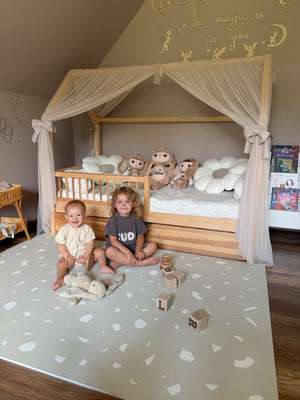 a soft terrazzo dove foam playmat in gentle morning light, creating a serene and safe play space