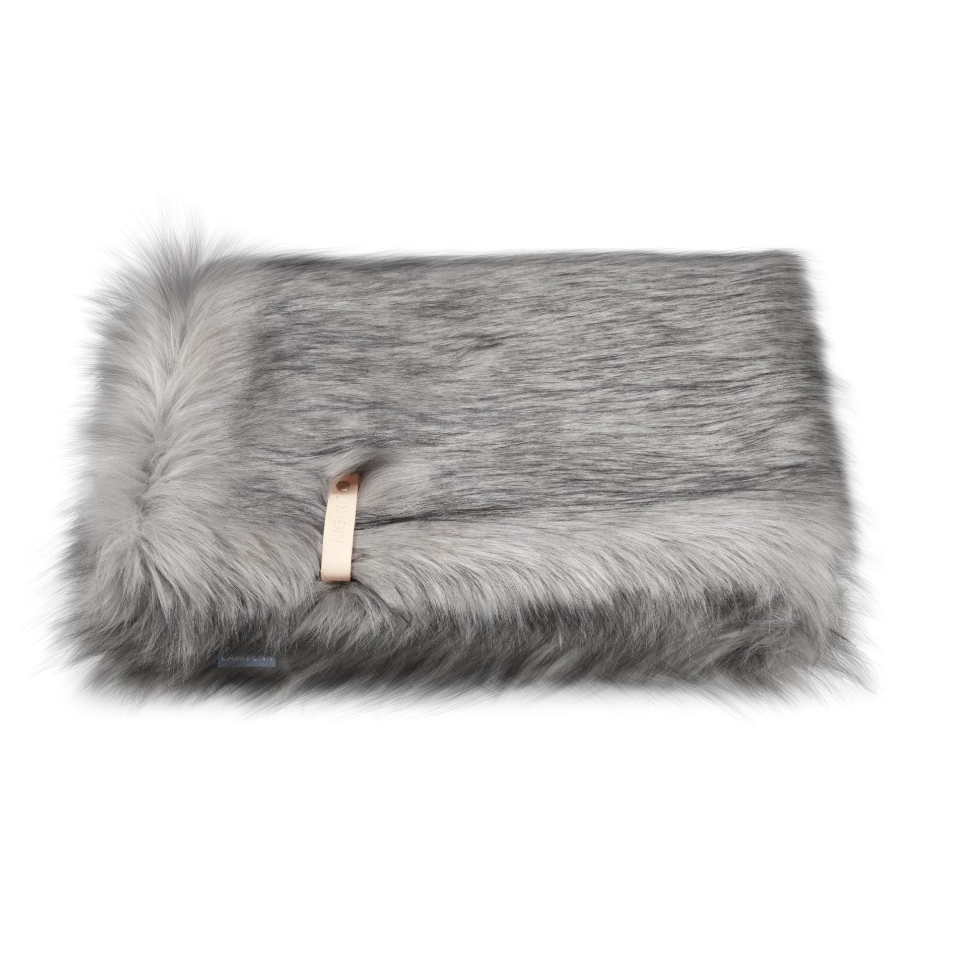 playful puppy peeking out from the cozy silver föra blanket with a leather belt