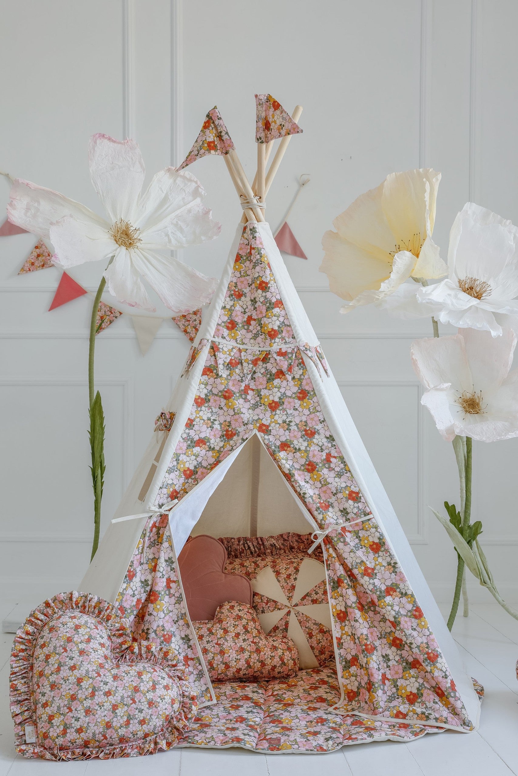functional cotton-linen birthday garland hung over a crib with soft mint velvet pendants