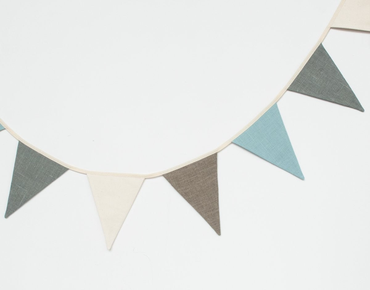 functional linen garland draped over a rustic shelf for a kids room