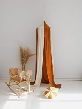 bold forest friends garland with 9 cotton and velvet pendants hanging confidently above a childs bed