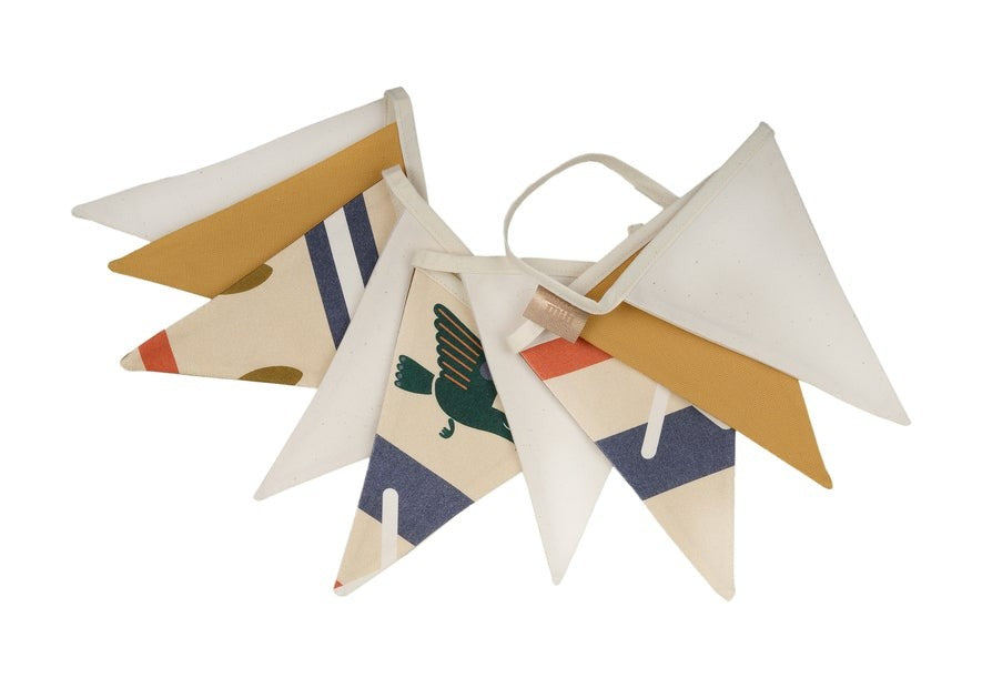 moi mili native vibe cotton garland draped on a sunlit playroom wall