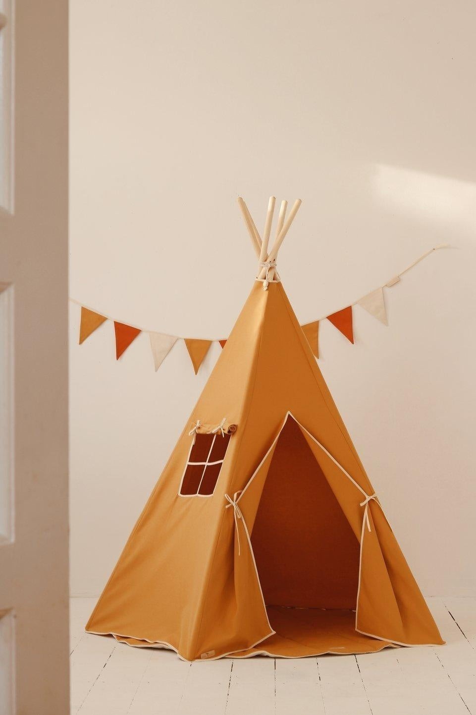playful ochre floral garland casting a warm shadow on a child's playroom wall
