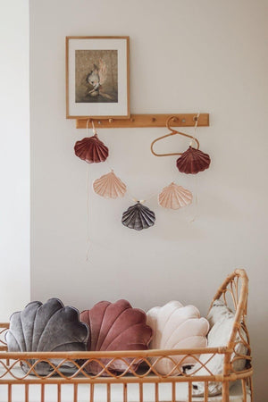bold cosmic pearl shell garland with marsala and apricot velvet shells, hanging on a beaded cotton string