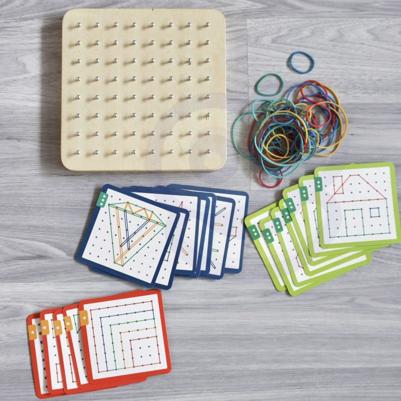 close-up of a child's hands using the woopie green geoplan wooden puzzle with rubber bands to create a geometric shape