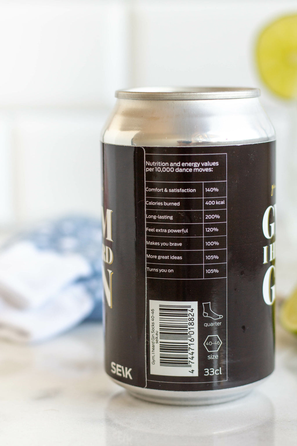 bold close-up of stylish gin and tonic socks on a gym floor, confident lifestyle statement