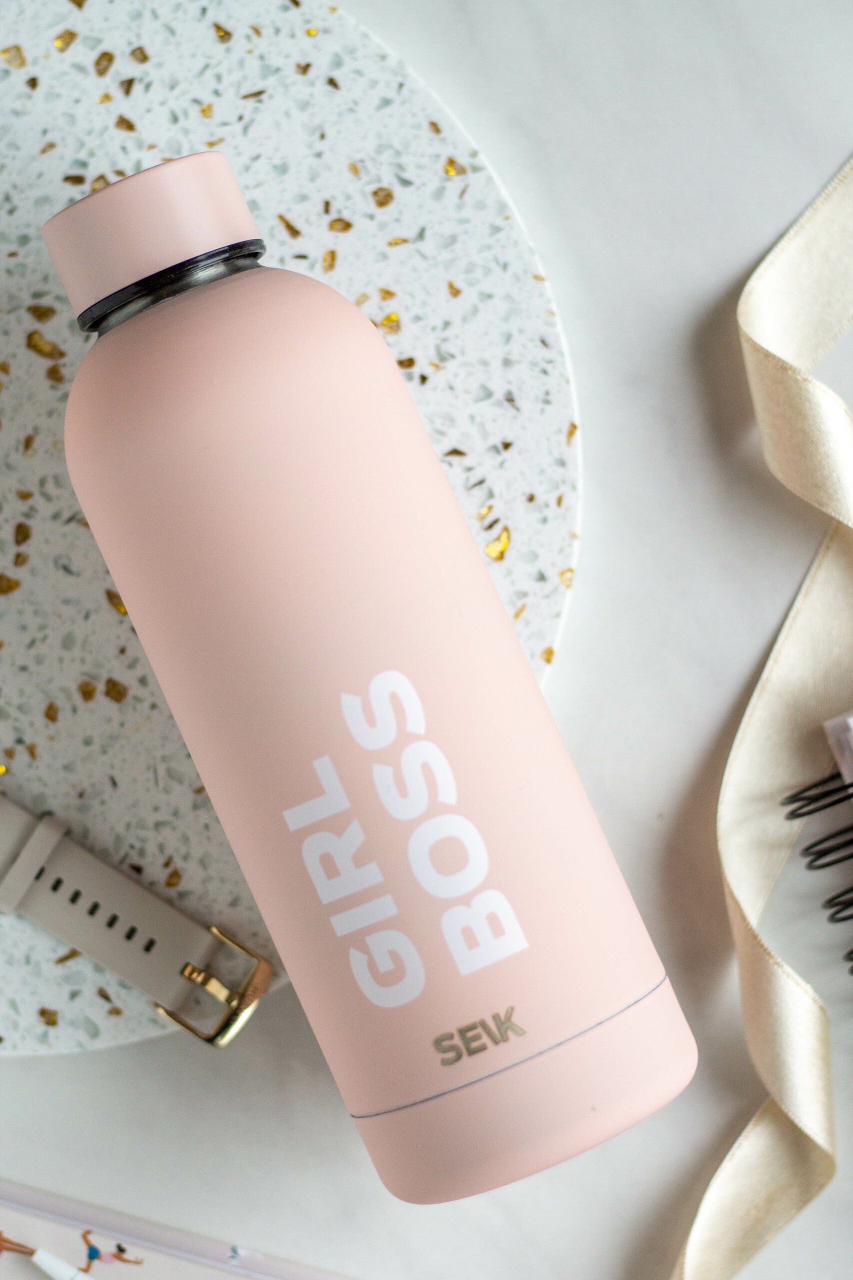 seik girl boss 500ml thermos in a practical workspace setting with a laptop