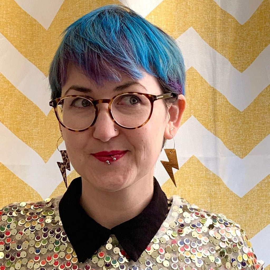 Gold and cheetah lightning bolt earrings