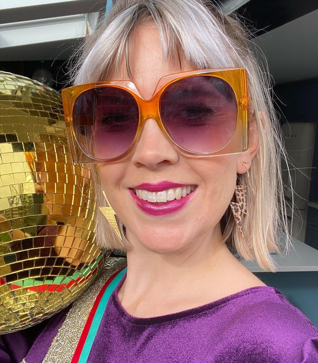 Gold and cheetah lightning bolt earrings