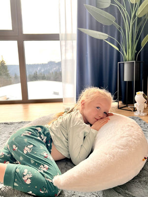 bold statement moon pillow for a modern nursery