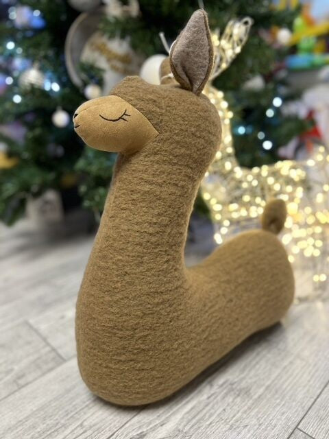 bold alpaca plush pillow in warm toast color, a confident snuggle companion