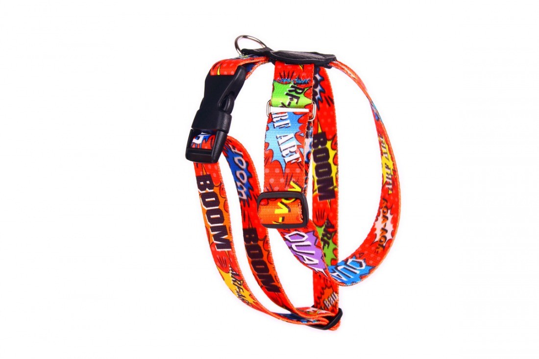 a soft red graffiti leather dog harness shown on a calm pet in gentle morning light