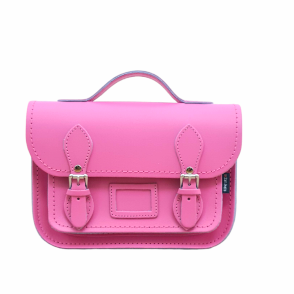 Pink satchel with straps on a white background