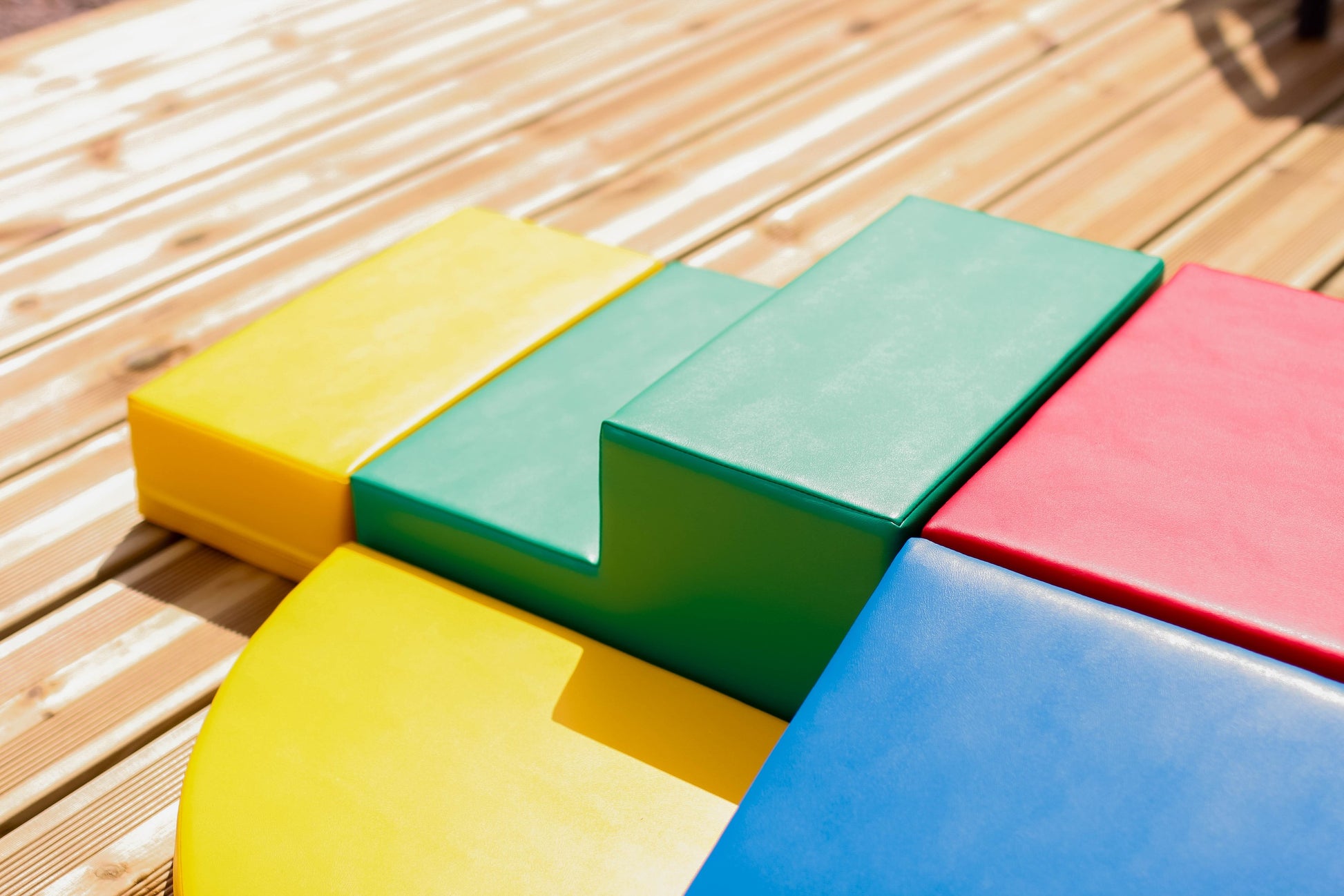a soft multicolor foam corner climber block set for toddlers in a cozy nursery