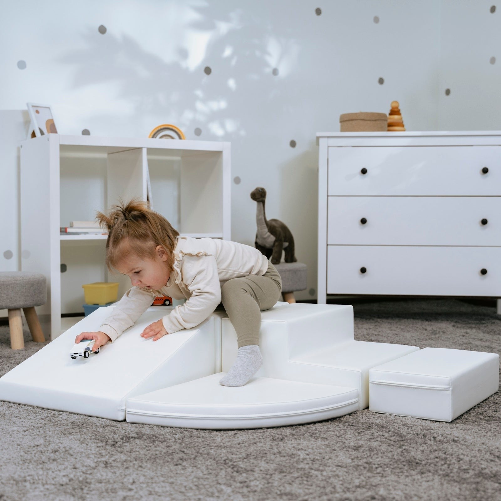 gentle white corner climber foam block in a soft, cozy nursery setting