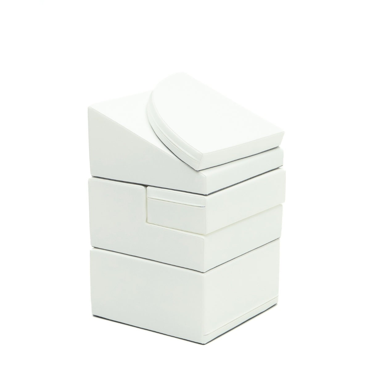 a toddler's hand reaching for the top of a soft white foam corner climber