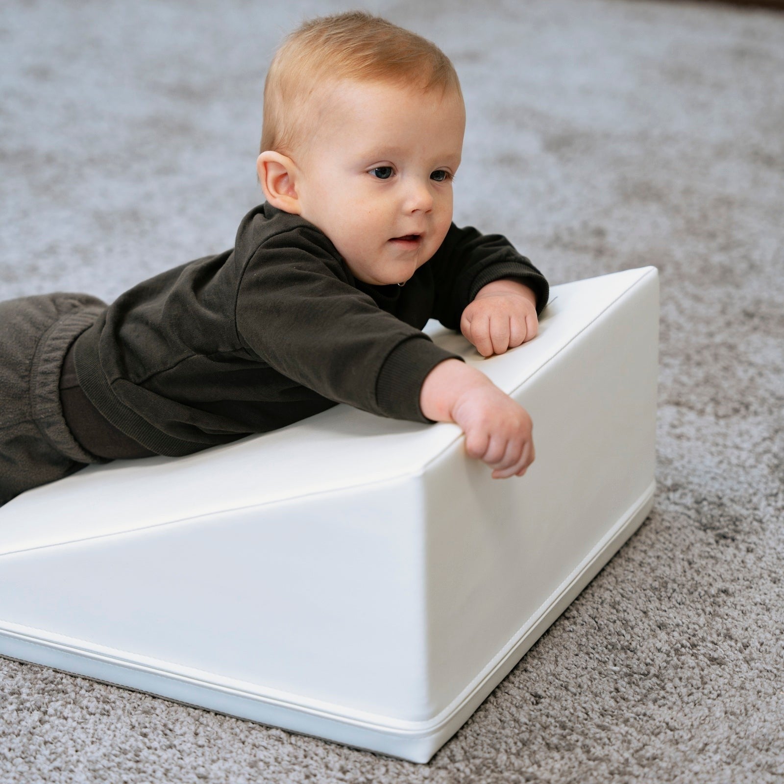 soft white corner climber foam block in a bright, airy nursery setting