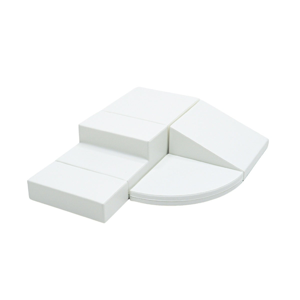 a toddler building a small castle with soft white foam climber blocks